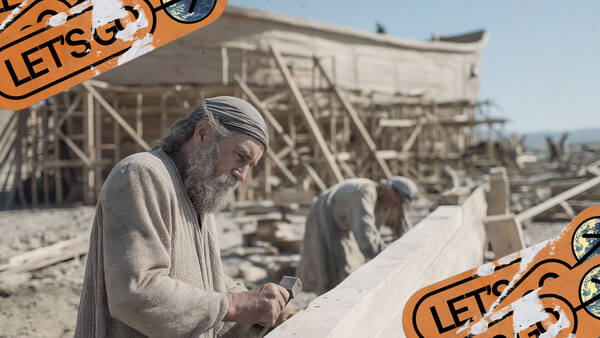 Noah works on a large wood beam while building the ark